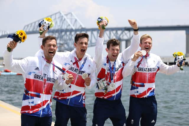 Silver medallists Jack Beaumont, Angus Groom, Tom Barras and Harry Leask celebrate at Sea Forest Waterway in Tokyo. Picture: Naomi Baker/Getty Images