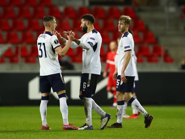 Borna Barisic, Connor Goldson and Filip Helander of Rangers celebrate following the UEFA Europa League Round of 32 match between Royal Antwerp FC and Rangers FC at Bosuilstadion on February 18, 2021 (Photo by Dean Mouhtaropoulos/Getty Images)