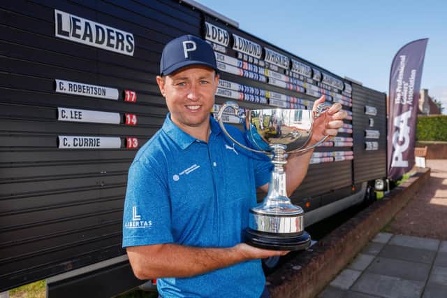 Graeme Robertson proudly shows off the trophy after winning the Loch Lomond Whiskies Scottish PGA Championship at Scotscraig Golf Club in Tayport. Picture: Kenny Smith/Getty Images.