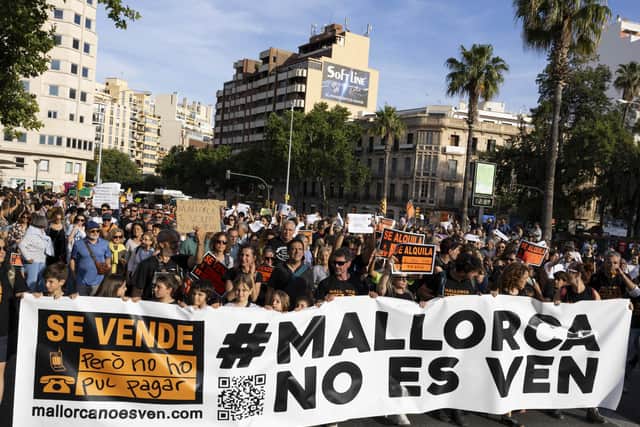 Protesters hold a banner reading 'Mallorca is not for sale' during a demonstration against mass tourism in Palma. Picture: AFP via Getty Images