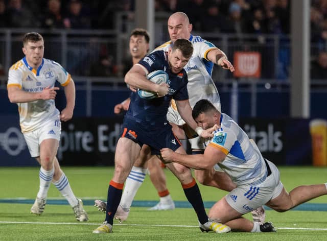 Edinburgh's Mark Bennett and Leinster's Michael Milne during the URC clash at the DAM Health Stadium.