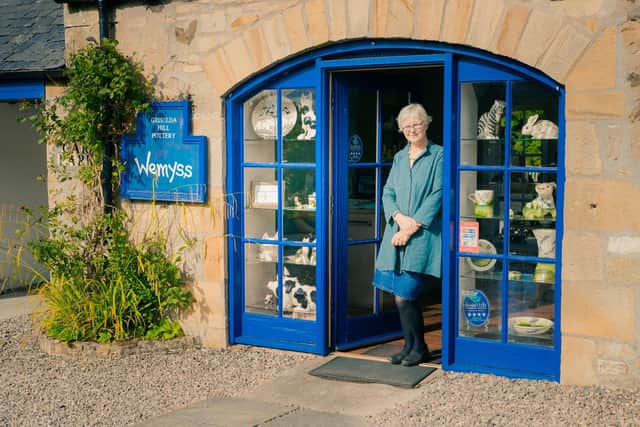 Griselda Hill, seen here, in her studio/shop at Wemyss Ware pottery, hand paints the ceramic's she creates. The studio and shop are situated in Ceres in the Kingdom of Fife.