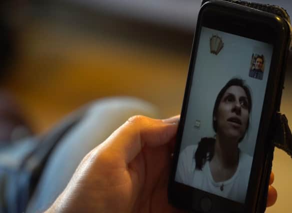 Nazanin Zaghari-Ratcliffe speaking on FaceTime with her husband Richard while still in Iran Photo: Darius Bazargan.