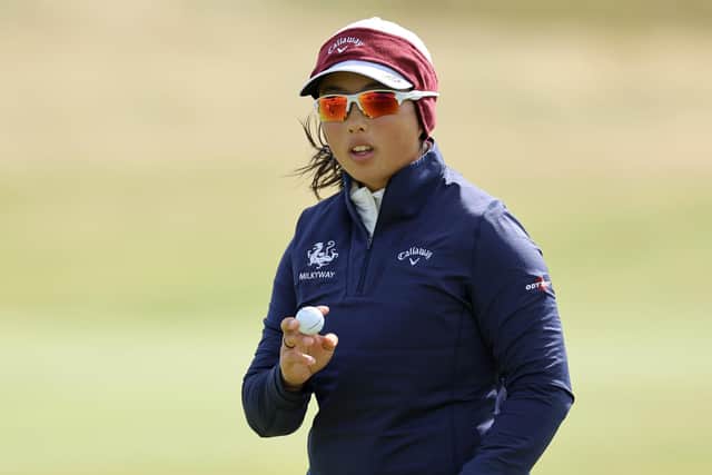 Ruoning Yin of China acknowledges the crowd during the first round of the AIG Women's Open at St Andrews. Picture: Michael Reaves/Getty Images.
