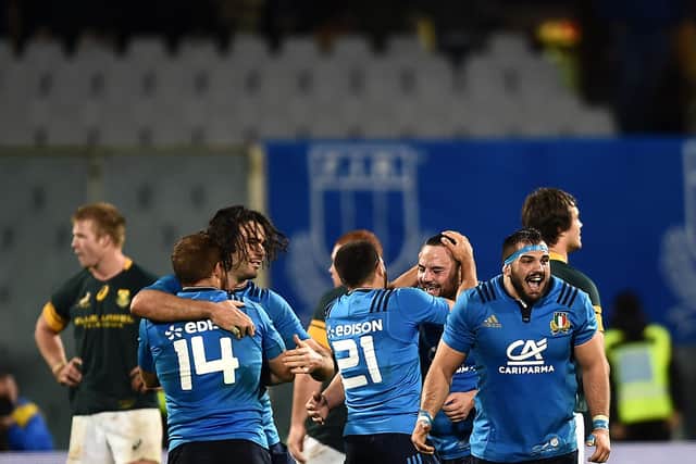 Italy players celebrate their stunning win over South Africa in Florence in 2016.