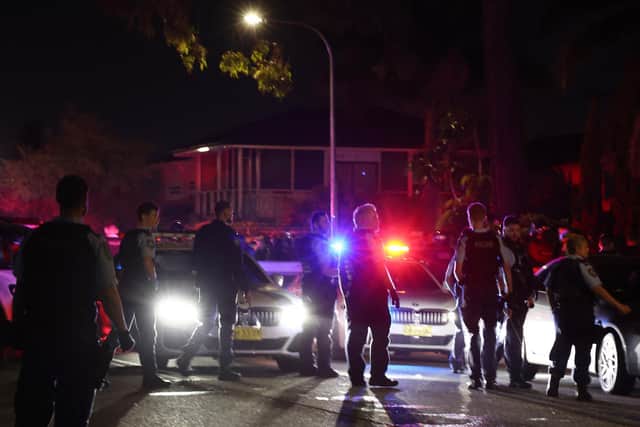 New South Wales police gather outside the Christ the Good Shepherd Church in Sydney's western suburb of Wakeley (Photo by DAVID GRAY / AFP)