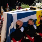 The Duke of Edinburgh's coffin, covered with his Personal Standard, being carried into St George's Chapel, Windsor Castle, Berkshire.