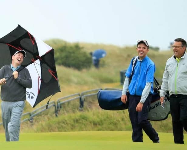 Bob MacIntyre has a laugh with Greg Milne, his caddie at the time, and coach David Burns during a practice round for the 148th Open Championshipat Royal Portrush in 2019. Picture: Andrew Redington/Getty Images.