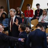 Police and security staff deal with a protester in the public gallery during First Minister's Questions at Scottish Parliament (Picture: Jeff J Mitchell/Getty Images)