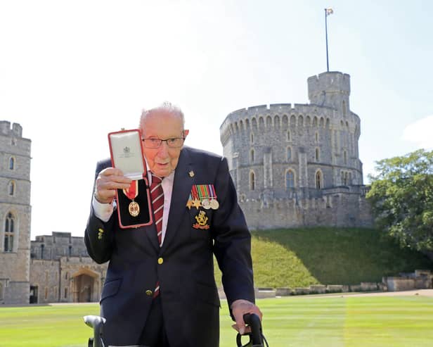 Second World War veteran Captain Sir Tom Moore poses with his medal after being made a Knight Bachelor for raising over £32 million for the NHS during the Covid pandemic (Picture: Chris Jackson/pool/AFP via Getty Images)