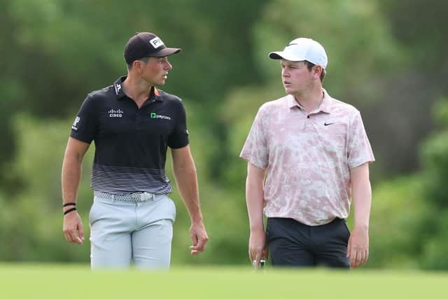 Viktor Hovland Bob MacIntyre walk on the third hole during day two of the DP World Tour Championship on the Earth Course at Jumeirah Golf Estates in Dubai. Picture: Andrew Redington/Getty Images.