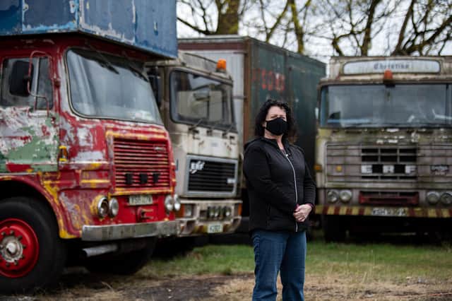 Natalie Cowie-Kayes of Mosshouse Showman’s Yard in the north of Glasgow stands in front of some lorries that she and her family will be restoring over lockdown as the pandemic keeps them off the road for another summer. PIC: John Devlin.