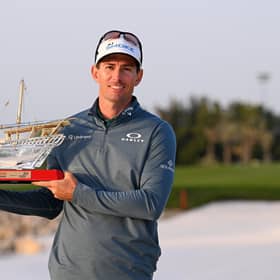 Dylan Frittelli of South Africa poses with the trophy as he celebrates victory following Day Four of the Ras Al Khaimah Championship at Royal Golf Club in Bahrain.