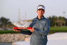 Dylan Frittelli of South Africa poses with the trophy as he celebrates victory following Day Four of the Ras Al Khaimah Championship at Royal Golf Club in Bahrain.