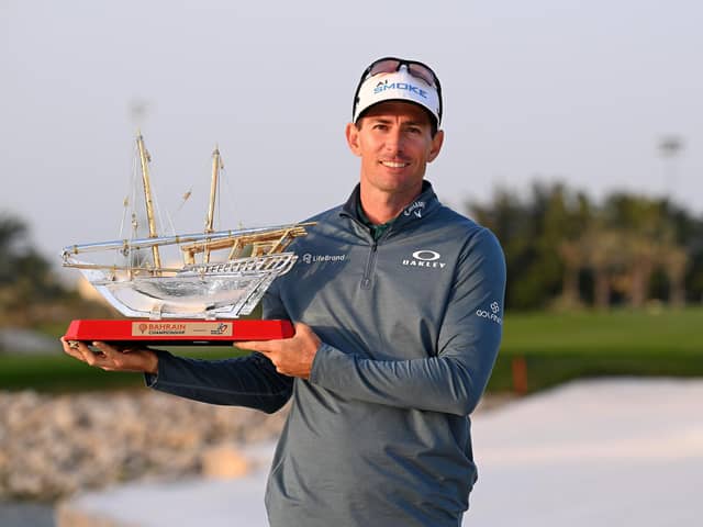 Dylan Frittelli of South Africa poses with the trophy as he celebrates victory following Day Four of the Ras Al Khaimah Championship at Royal Golf Club in Bahrain.