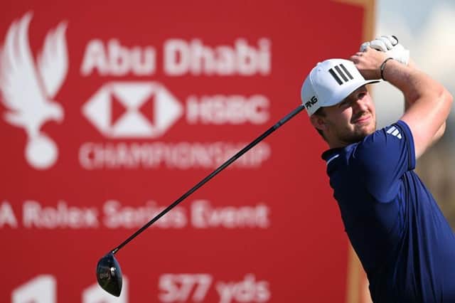 Connor Syme tees off on the 11th hole in the third round of the Abu Dhabi HSBC Championship at Yas Links. Picture: Ross Kinnaird/Getty Images.
