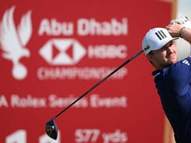 Connor Syme tees off on the 11th hole in the third round of the Abu Dhabi HSBC Championship at Yas Links. Picture: Ross Kinnaird/Getty Images.