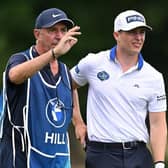 Calum Hill chars to his caddie Phil 'Wobb;y Mobley during the BMW International Open at Golfclub Munchen Eichenried in Germany. Picture: Stuart Franklin/Getty Images.