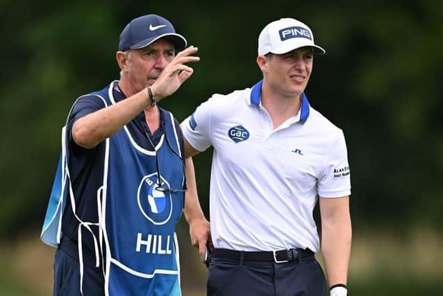 Calum Hill chars to his caddie Phil 'Wobb;y Mobley during the BMW International Open at Golfclub Munchen Eichenried in Germany. Picture: Stuart Franklin/Getty Images.
