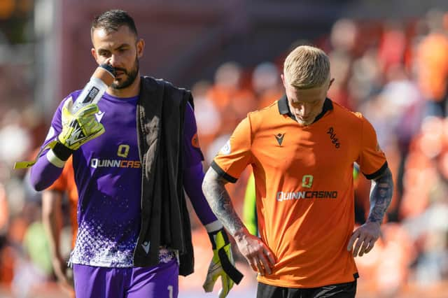 Dundee United's Mark Birighitti and Craig Sibbald looks dejected at full time following the 3-1 defeat by Ross County.