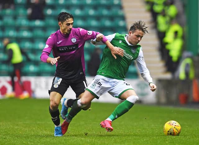 Hibs midfielder Scott Allan holds off St Mirren winger Ilkay Durmus during the last meeting between the two teams at Easter Roa in February