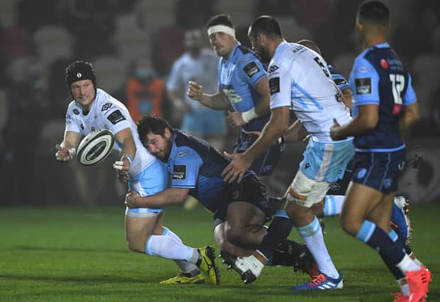 Brad Thyer is pictured tackling Glasgow Warriors' Pete Horne last season. Glasgow have signed the prop on loan from Cardiff. (Photo by Stu Forster/Getty Images)