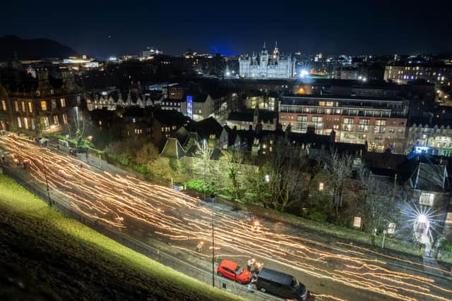 A torchlight procession was staged through Edinburgh city centre to herald the launch of the city's four-day Hogmanay festival. Picture: Jane Barlow/PA Wire