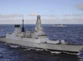 HMS Defender and frigate Admiral Gorshkov in the background.