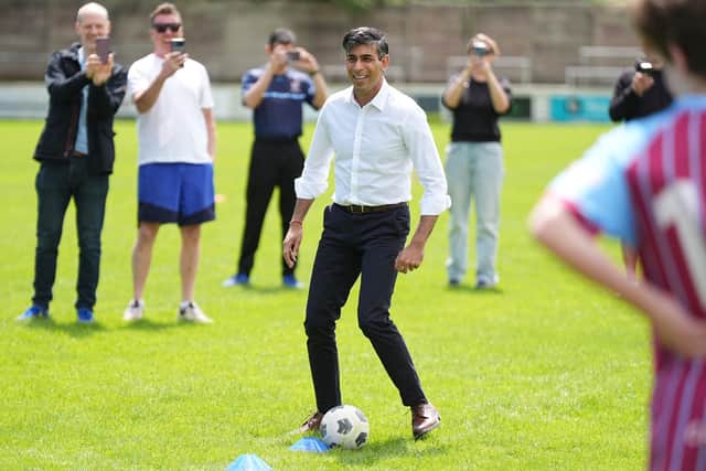 Rishi Sunak just before he lost the ball in a tackle with a training cone at Chesham United FC (Picture: Aaron Chown/PA)