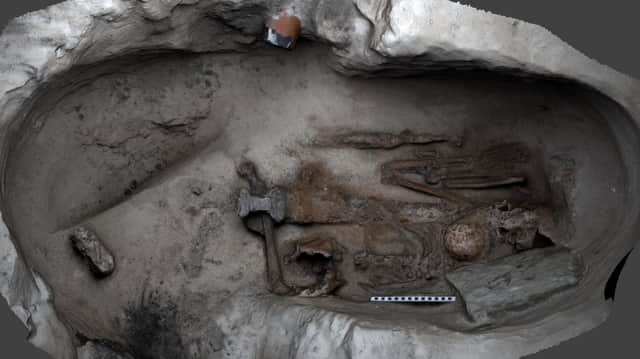 The inside of the Viking grave with the remains of what is believed to be a large man, who was buried with a sword placed over his body. PIC: HES.