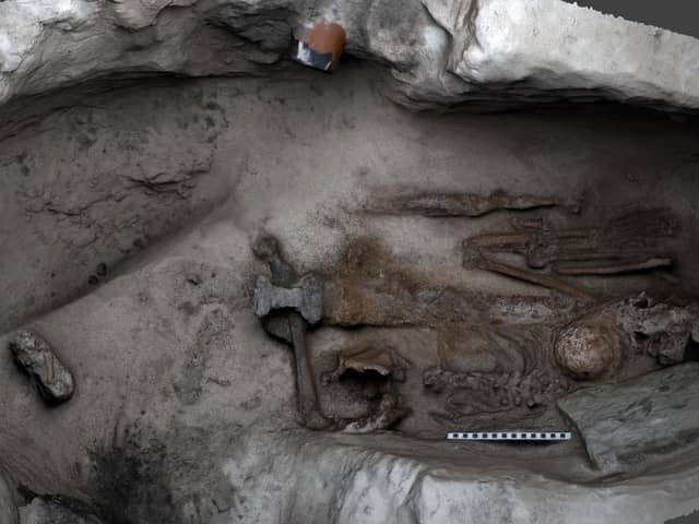 The inside of the Viking grave with the remains of what is believed to be a large man, who was buried with a sword placed over his body. PIC: HES.