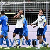 England's midfielder Jude Bellingham (C) reacts after missing a chance during the Nations League 1-0 defeat by Italy.