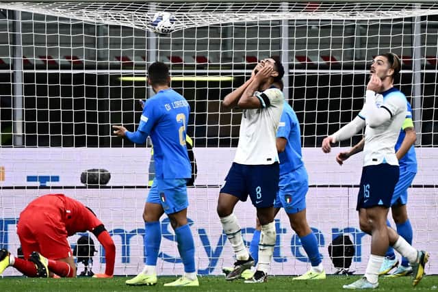 England's midfielder Jude Bellingham (C) reacts after missing a chance during the Nations League 1-0 defeat by Italy.
