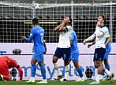 England's midfielder Jude Bellingham (C) reacts after missing a chance during the Nations League 1-0 defeat by Italy.