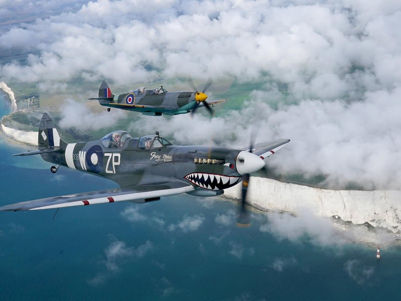 Chelsea pensioner Mike Smith in the rear of one of two Spitfires flying over Sussex during a surprise flight organised by the Taxi Charity for Military Veterans