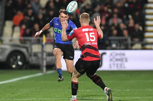 Blues' Cole Forbes (L) and Crusaders' Johnny McNicholl compete for the ball during a Super Rugby Pacific match at Apollo Projects Stadium in Christchurch. (Photo by Sanka Vidanagama / AFP via Getty Images)