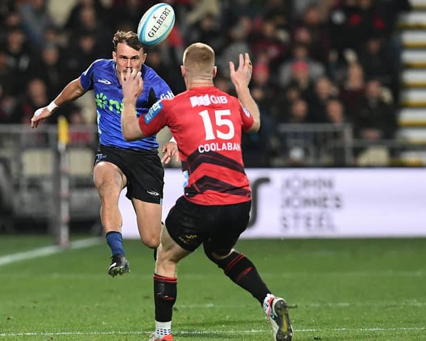 Blues' Cole Forbes (L) and Crusaders' Johnny McNicholl compete for the ball during a Super Rugby Pacific match at Apollo Projects Stadium in Christchurch. (Photo by Sanka Vidanagama / AFP via Getty Images)