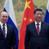 Russian President Vladimir Putin (L) and Chinese President Xi Jinping pose during their meeting in Beijing, on February 4, 2022. (Photo by Alexei Druzhinin / Sputnik / AFP) (Photo by ALEXEI DRUZHININ/Sputnik/AFP via Getty Images)