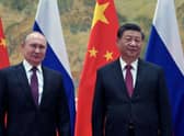 Russian President Vladimir Putin (L) and Chinese President Xi Jinping pose during their meeting in Beijing, on February 4, 2022. (Photo by Alexei Druzhinin / Sputnik / AFP) (Photo by ALEXEI DRUZHININ/Sputnik/AFP via Getty Images)
