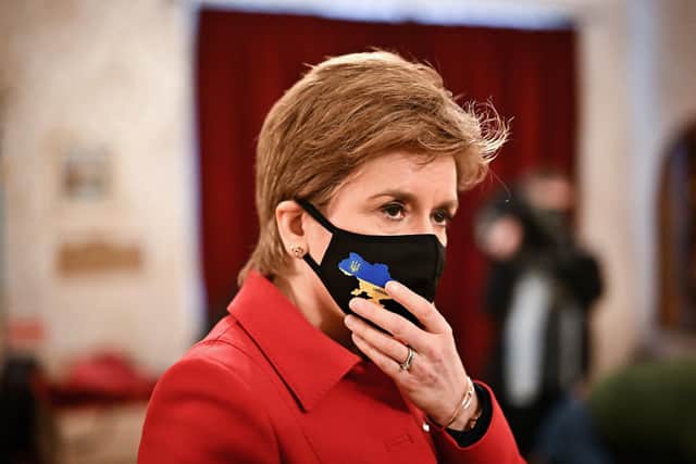 Nicola Sturgeon wears a face mask with a map of Ukraine on it as she meets members of the Ukrainian Community as she views donations at the Edinburgh Ukrainian Club on March 9. Picture: Jeff J Mitchell/Getty Images