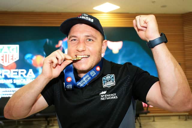 A jubilant Duncan Weir lands back at Glasgow Airport with his United Rugby Championship winners' medal after Glasgow Warriors' victory over the Vodacom Bulls in the final in South Africa. (Photo by Ewan Bootman / SNS Group)