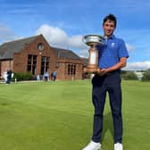 Gullane's Oliver Mukherjee shows off the trophy after winning the Scottish Amateur at Gailes Links. Picture: Scottish Golf.