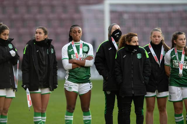 Hibs players look dejected as they receive their runners-up medals after losing 2-0 to Rangers in the SWPL Sky Sports Cup final at Tynecastle Park. (Photo by Mark Scates / SNS Group)