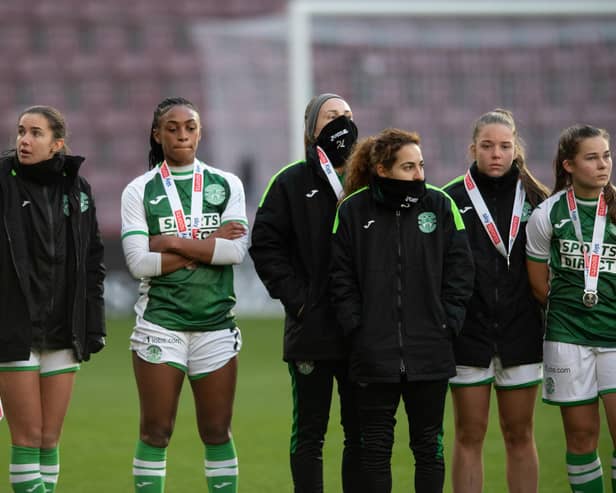 Hibs players look dejected as they receive their runners-up medals after losing 2-0 to Rangers in the SWPL Sky Sports Cup final at Tynecastle Park. (Photo by Mark Scates / SNS Group)