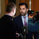 Humza Yousaf speaks to the media on his way to the main chamber for First Minster's Questions. Picture: Andrew Milligan/PA Wire