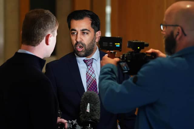 Humza Yousaf speaks to the media on his way to the main chamber for First Minster's Questions. Picture: Andrew Milligan/PA Wire