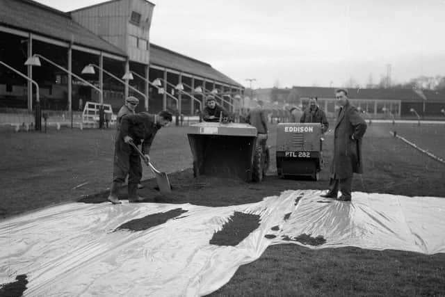 Powderhall prepares a surface of red blaes for the New Year Sprint 1960