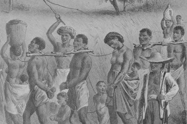 An image of men, women and children being taken into slavery in West Africa, circa 1700 (Picture: Rischgitz/Getty Images)