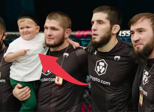 Hasbulla Magomedov and legendary pro MMA fighter Khabib Nurmagomedov celebrate in the Octagon after a UFC 267 event in the UAE in 2021.