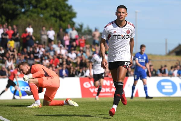 Christian Ramirez scored twice for Aberdeen against Peterhead.